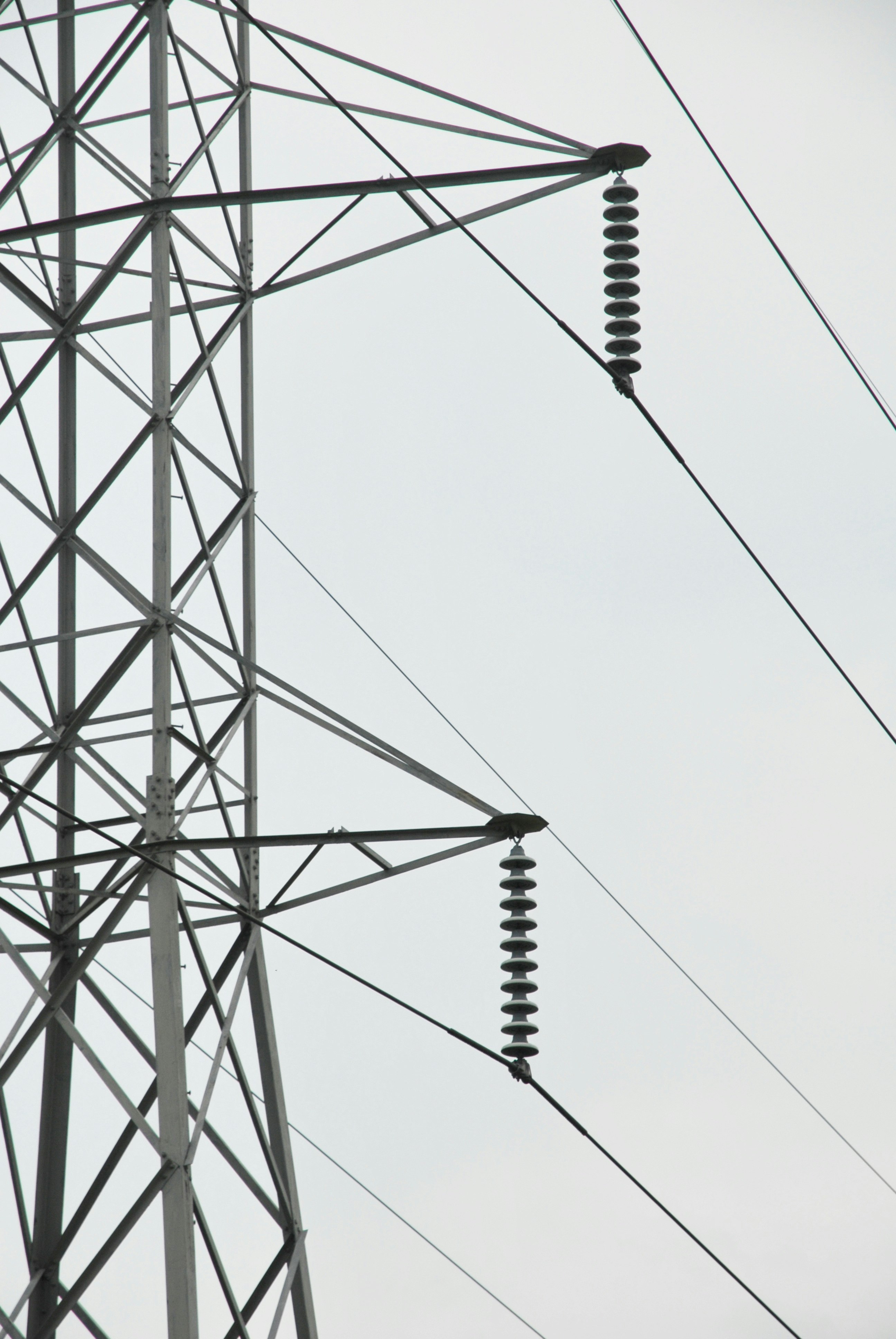 black metal electric tower under white sky